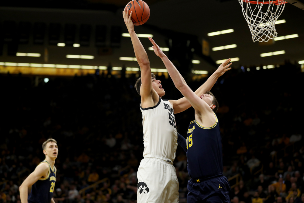 Iowa Hawkeyes forward Luka Garza (55) puts up a shot against the Michigan Wolverines Friday, January 17, 2020 at Carver-Hawkeye Arena. (Brian Ray/hawkeyesports.com)