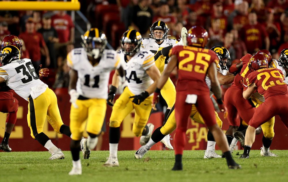 Iowa Hawkeyes punter Michael Sleep-Dalton (22) punts the ball against the Iowa State Cyclones Saturday, September 14, 2019 in Ames, Iowa. (Brian Ray/hawkeyesports.com)