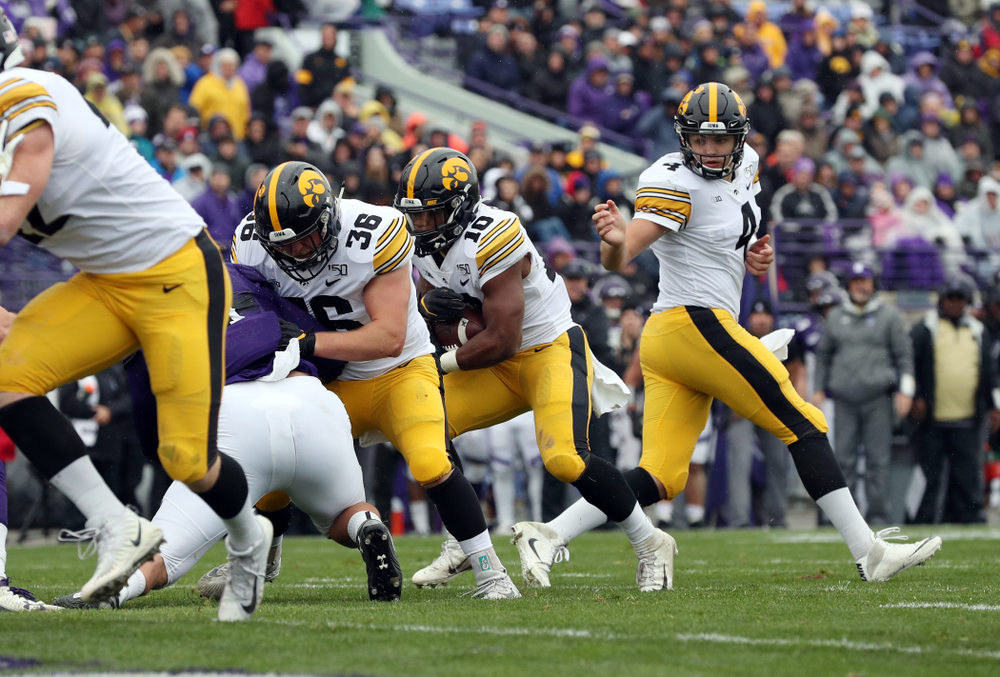 Iowa Hawkeyes running back Mekhi Sargent (10) gets a block from fullback Brady Ross (36) on his way to a touchdown against the Northwestern Wildcats Saturday, October 26, 2019 at Ryan Field in Evanston, Ill. (Brian Ray/hawkeyesports.com)