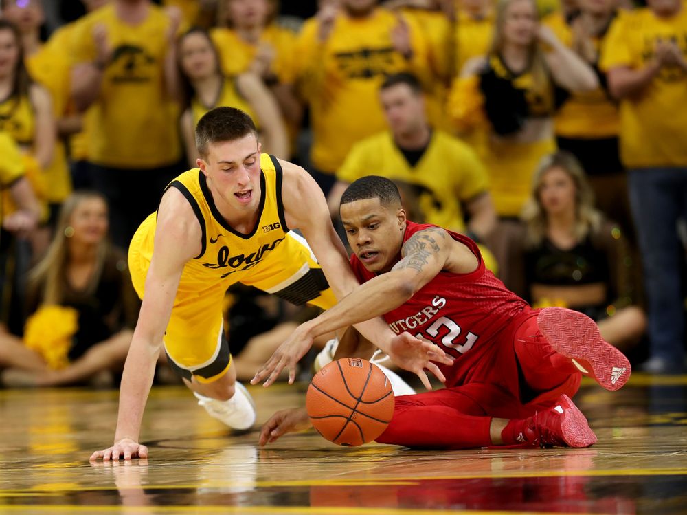 Iowa Hawkeyes guard Joe Wieskamp (10) battles for a loose ball against the Rutgers Scarlet Knights Wednesday, January 22, 2020 at Carver-Hawkeye Arena. (Brian Ray/hawkeyesports.com)