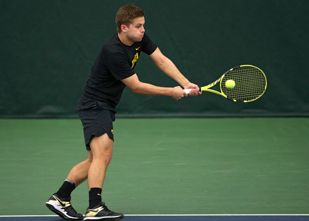 Iowa’s Will Davies returns a shot during his doubles match at the Hawkeye Tennis and Recreation Complex in Iowa City on Friday, March 6, 2020. (Stephen Mally/hawkeyesports.com)
