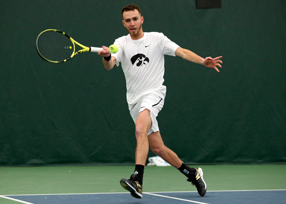 Iowa’s Kareem Allaf returns a shot during his singles match at the Hawkeye Tennis and Recreation Complex in Iowa City on Sunday, February 16, 2020. (Stephen Mally/hawkeyesports.com)