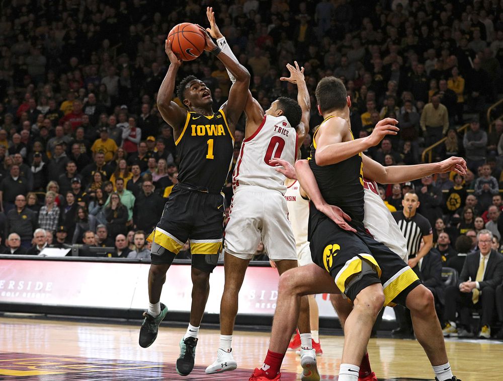 Iowa Hawkeyes guard Joe Toussaint (1) makes a basket while being fouled during the second half of their game at Carver-Hawkeye Arena in Iowa City on Monday, January 27, 2020. (Stephen Mally/hawkeyesports.com)
