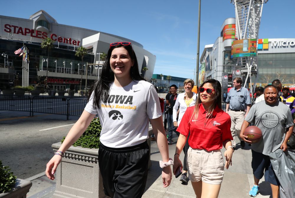 Iowa Hawkeyes forward Megan Gustafson (10) walks past the Staples Center following a Special Olympics event Friday, April 12, 2019 as part of the ESPN College Basketball Awards in the XBOX Plaza at LA Live. (Brian Ray/hawkeyesports.com)