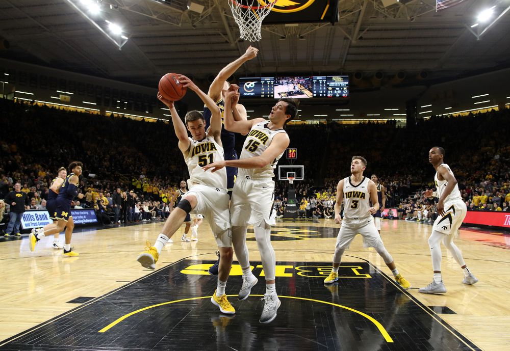 Iowa Hawkeyes forward Nicholas Baer (51) and forward Ryan Kriener (15) against the Michigan Wolverines Friday, February 1, 2019 at Carver-Hawkeye Arena. (Brian Ray/hawkeyesports.com)