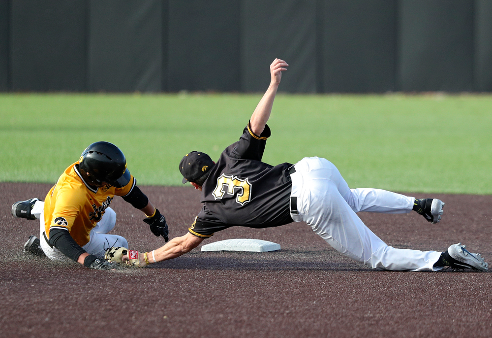 Iowa catcher Brett McCleary (32) avoids a tag by infielder Sam Link (3) as he steals second base during the third inning of the first game of the Black and Gold Fall World Series at Duane Banks Field in Iowa City on Tuesday, Oct 15, 2019. (Stephen Mally/hawkeyesports.com)