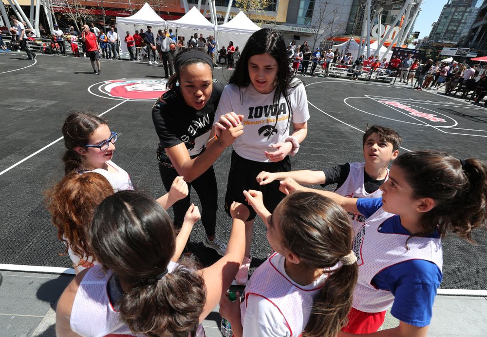 Iowa Hawkeyes forward Megan Gustafson (10) and UCONNÕs Napheesa Collier coach a team during a youth clinic and game Friday, April 12, 2019 in the XBOX Plaza at LA Live. (Brian Ray/hawkeyesports.com)