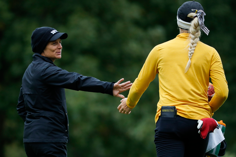 Iowa head coach Megan Menzel greets Shawn Rennegarbe as she makes her way to the eighth tee during the Diane Thomason Invitational at Finkbine Golf Course on September 29, 2018. (Tork Mason/hawkeyesports.com)