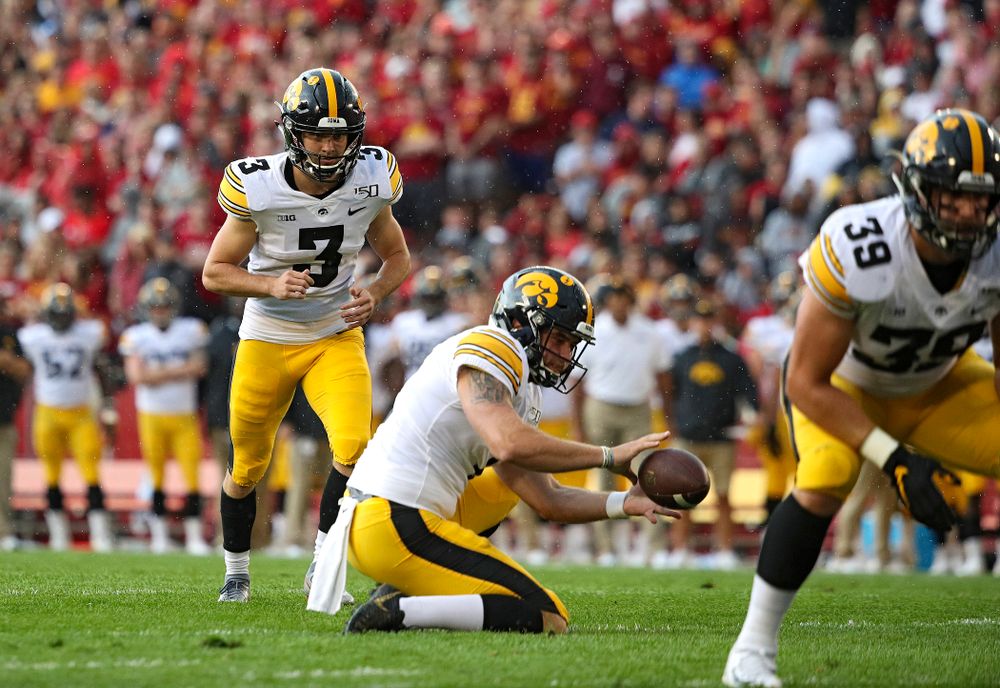 Iowa Hawkeyes place kicker Keith Duncan (3) lines up to kick a field goal as punter Colten Rastetter (7) handles the snap during the first quarter of their Iowa Corn Cy-Hawk Series game at Jack Trice Stadium in Ames on Saturday, Sep 14, 2019. (Stephen Mally/hawkeyesports.com)