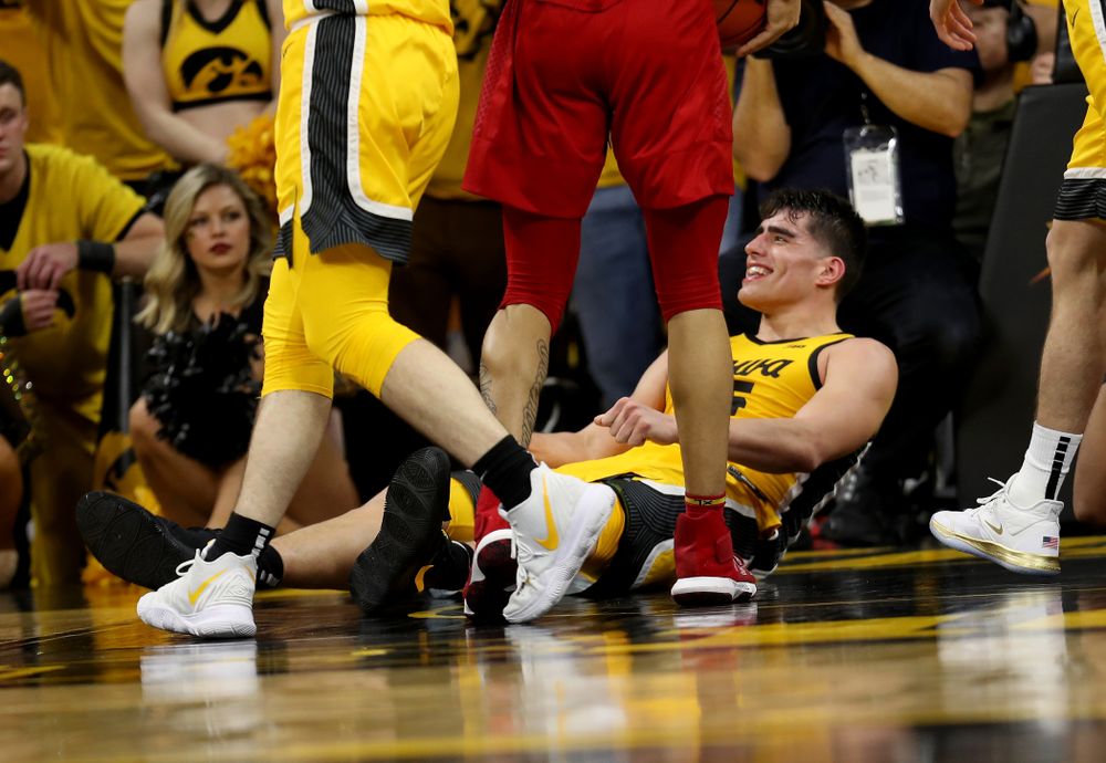 Iowa Hawkeyes forward Luka Garza (55) smiles after drawing a charging foul against the Rutgers Scarlet Knights Wednesday, January 22, 2020 at Carver-Hawkeye Arena. (Brian Ray/hawkeyesports.com)