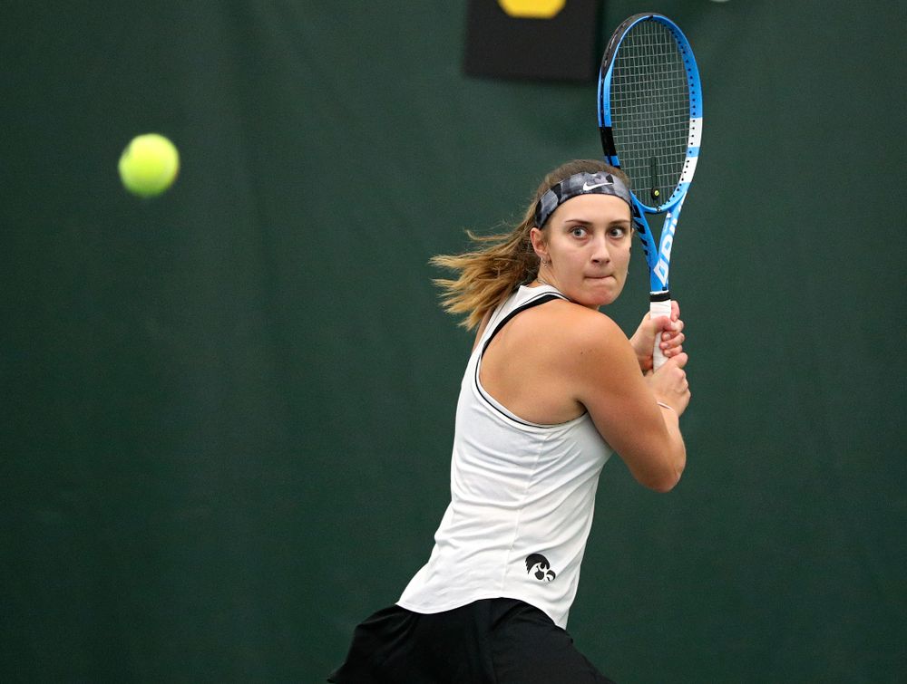 Iowa’s Ashleigh Jacobs returns a shot during her singles match at the Hawkeye Tennis and Recreation Complex in Iowa City on Sunday, February 16, 2020. (Stephen Mally/hawkeyesports.com)
