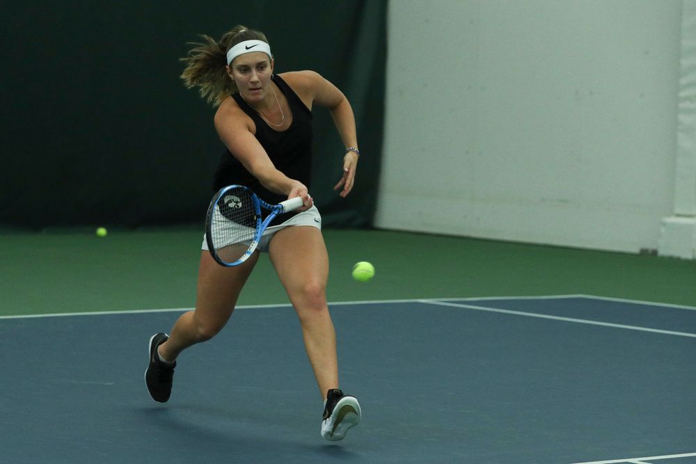 Iowa’s Ashleigh Jacobs returns a hit during the Iowa women’s tennis meet vs DePaul on Friday, February 21, 2020 at the Hawkeye Tennis and Recreation Complex. (Lily Smith/hawkeyesports.com)