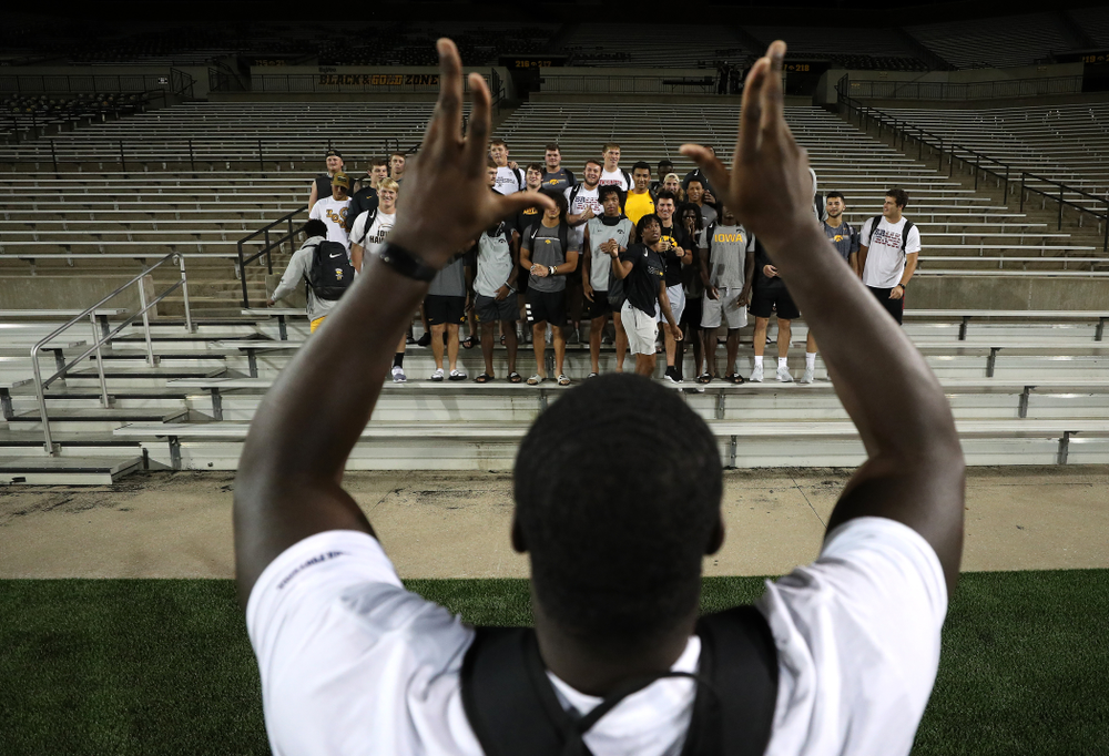 Iowa Hawkeyes defensive tackle Daviyon Nixon (54) leads the new players in the ÒFight SongÓ Thursday, August 22, 2019 at Kinnick Stadium in Iowa City. (Brian Ray/hawkeyesports.com)