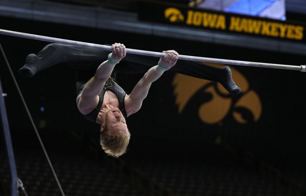 Iowa's Nick Merryman competes on the high bar against the Ohio State Buckeyes Saturday, March 16, 2019 at Carver-Hawkeye Arena. (Brian Ray/hawkeyesports.com)