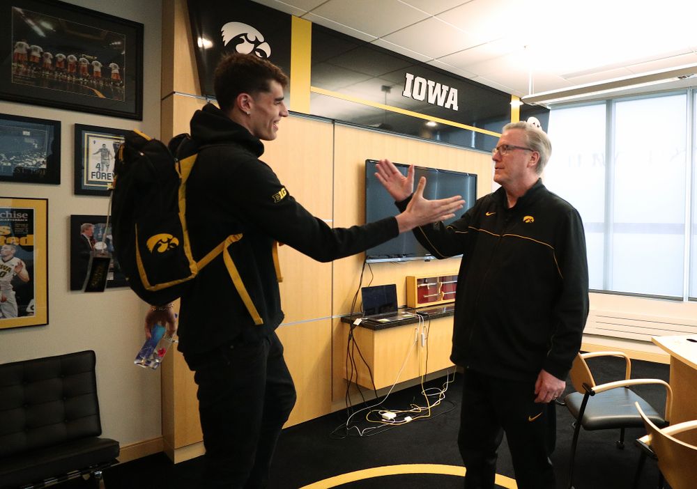 Iowa Hawkeyes head coach Fran McCaffery tells forward Luka Garza (55) that he has been named the Big Ten Player of the Year Monday, March 9, 2020 at Carver-Hawkeye Arena. (Brian Ray/hawkeyesports.com)