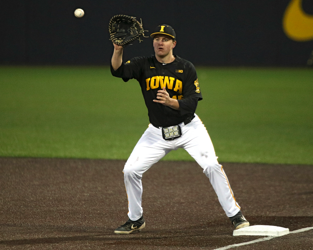 Iowa first baseman Peyton Williams (45) looks in a throw during the seventh inning of their game at Duane Banks Field in Iowa City on Tuesday, March 3, 2020. (Stephen Mally/hawkeyesports.com)