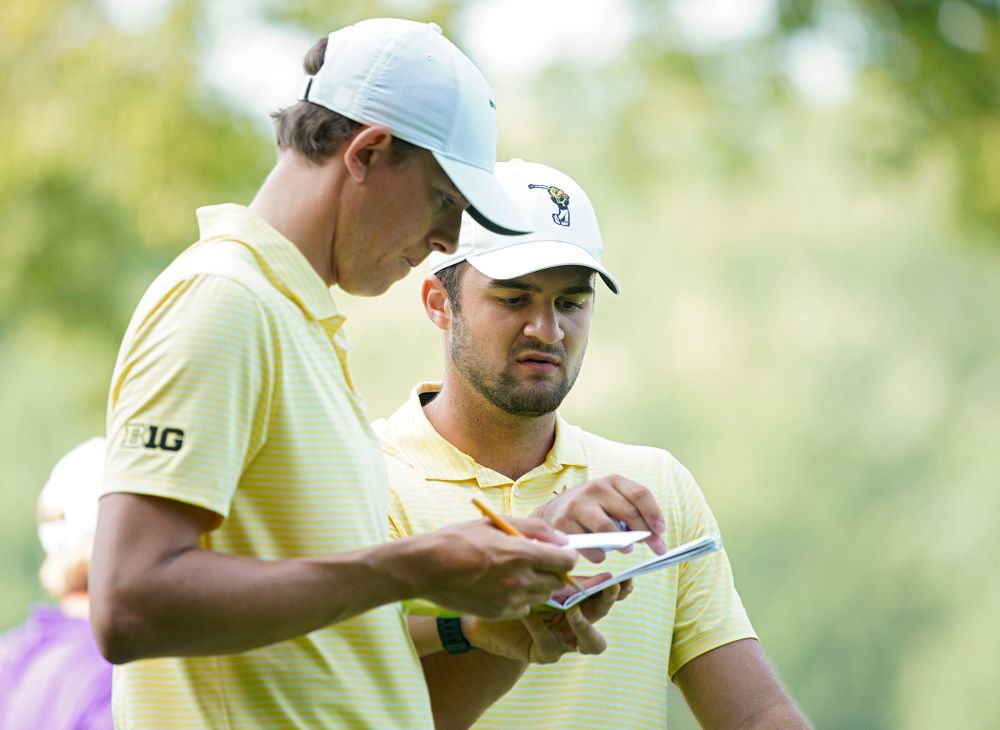 Iowa assistant coach Charlie Hoyle (from left) talks with Gonzalo Leal during the third day of the Golfweek Conference Challenge at the Cedar Rapids Country Club in Cedar Rapids on Tuesday, Sep 17, 2019. (Stephen Mally/hawkeyesports.com)