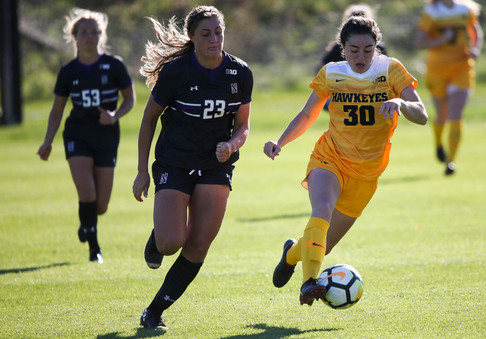Iowa Hawkeyes forward Devin Burns (30) dribbles the ball during a game against Northwestern at the Iowa Soccer Complex on October 21, 2018. (Tork Mason/hawkeyesports.com)