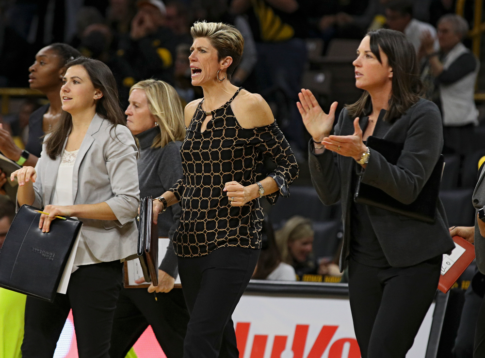 Iowa associate head coach Jan Jensen pumps her fist and assistant coach Abby Stamp claps during the third quarter of their overtime win against Princeton at Carver-Hawkeye Arena in Iowa City on Wednesday, Nov 20, 2019. (Stephen Mally/hawkeyesports.com)