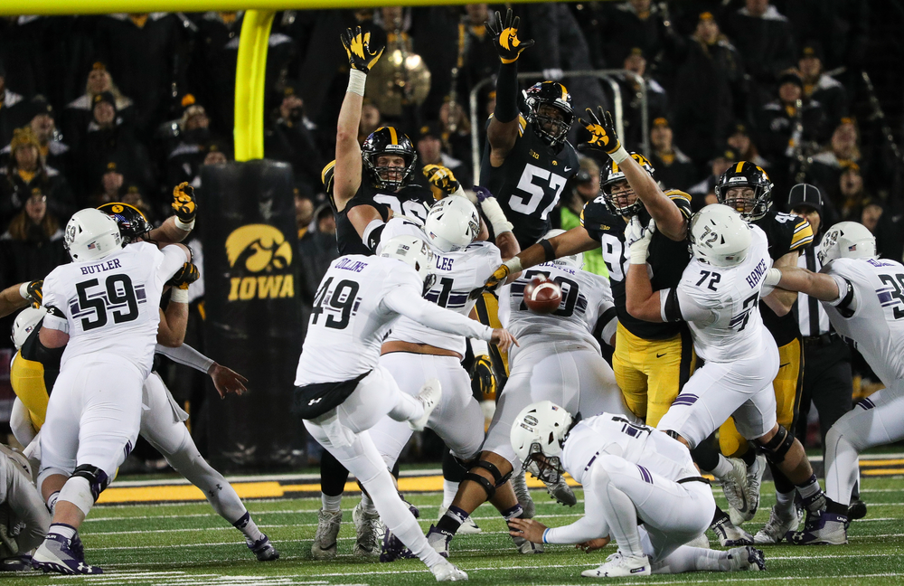 Iowa Hawkeyes defensive lineman Matt Nelson (96), Iowa Hawkeyes defensive end Chauncey Golston (57) and Iowa Hawkeyes defensive end Anthony Nelson (98) try to block a field goal attempt during a game against Northwestern at Kinnick Stadium on November 10, 2018. (Tork Mason/hawkeyesports.com)
