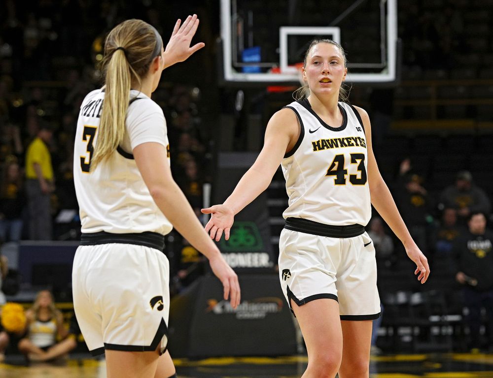Iowa Hawkeyes guard Makenzie Meyer (3) celebrates with forward Amanda Ollinger (43) in the closing seconds of the fourth quarter of the game at Carver-Hawkeye Arena in Iowa City on Thursday, February 6, 2020. (Stephen Mally/hawkeyesports.com)