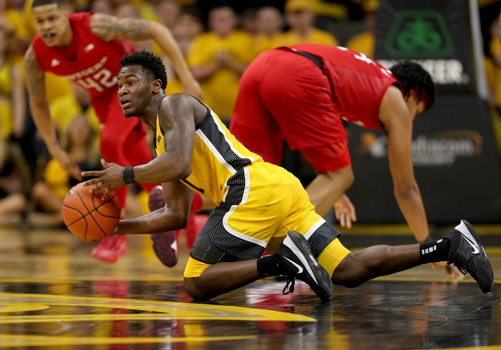Iowa Hawkeyes guard Joe Toussaint (1) collects a loose ball against the Rutgers Scarlet Knights Wednesday, January 22, 2020 at Carver-Hawkeye Arena. (Brian Ray/hawkeyesports.com)