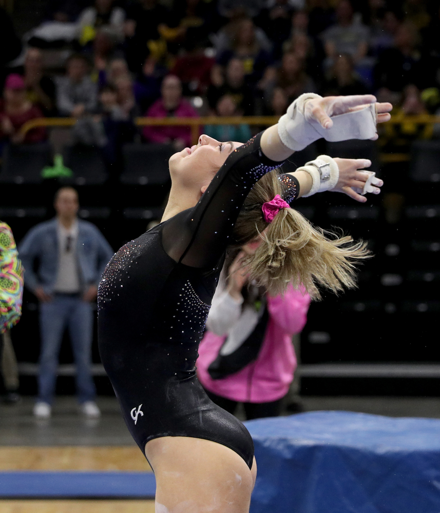 Iowa’s Alex Greenwald competes on the bars against Michigan Friday, February 14, 2020 at Carver-Hawkeye Arena. (Brian Ray/hawkeyesports.com)