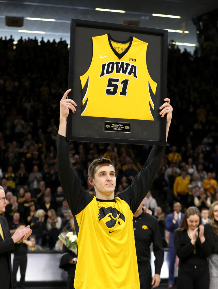 Iowa Hawkeyes forward Nicholas Baer (51) holds up his frames jersey during senior day activities before their game against the Rutgers Scarlet Knights Saturday, March 2, 2019 at Carver-Hawkeye Arena. (Brian Ray/hawkeyesports.com)