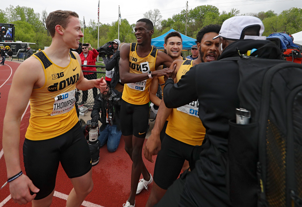 Iowa's Chris Thompson (from left), Wayne Lawrence Jr., Carter Lilly, and May’yea Harris celebrate after winning the 1600 meter relay event on the third day of the Big Ten Outdoor Track and Field Championships at Francis X. Cretzmeyer Track in Iowa City on Sunday, May. 12, 2019. (Stephen Mally/hawkeyesports.com)