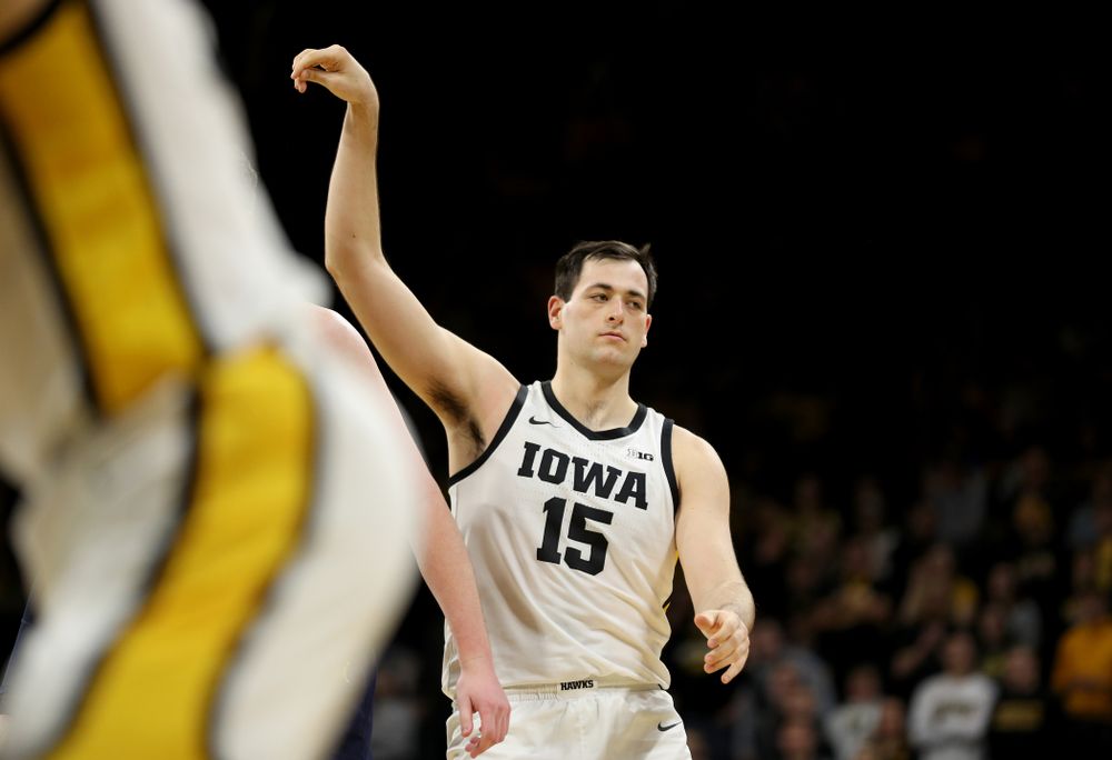 Iowa Hawkeyes forward Ryan Kriener (15) knocks down a a shot against the Michigan Wolverines Friday, January 17, 2020 at Carver-Hawkeye Arena. (Brian Ray/hawkeyesports.com)