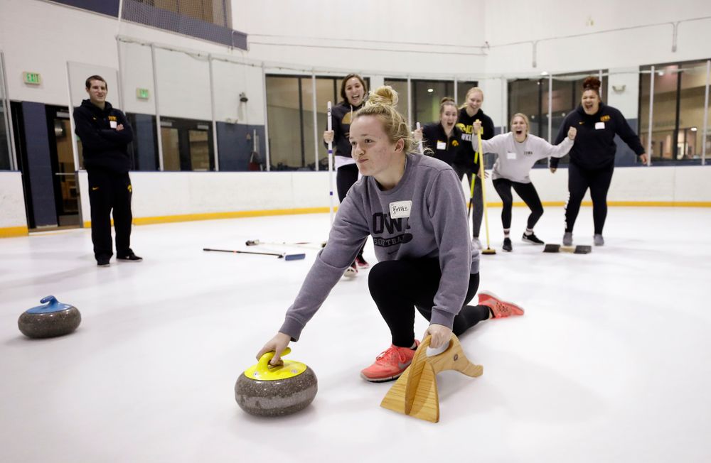 Members of the Iowa Softball team learn the sport of curling as part of a team building event Wednesday, January 10, 2018 at the Cedar Rapids Ice Arena. (Brian Ray/hawkeyesports.com)