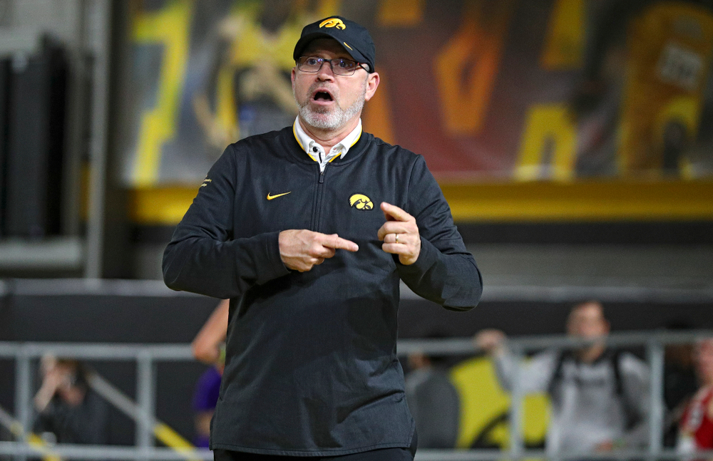 Iowa associate head coach Randy Hasenbank urges on his team during the women’s 3000 meter run event during the Hawkeye Invitational at the Recreation Building in Iowa City on Saturday, January 11, 2020. (Stephen Mally/hawkeyesports.com)