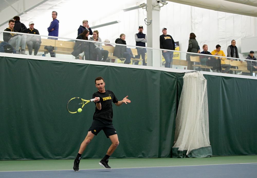 Iowa’s Kareem Allaf hits a shot during his match against Marquette at the Hawkeye Tennis and Recreation Complex in Iowa City on Saturday, January 25, 2020. (Stephen Mally/hawkeyesports.com)
