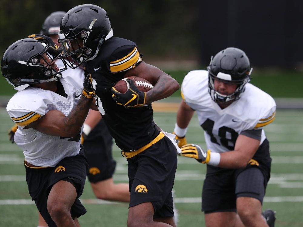 Iowa Hawkeyes wide receiver Ihmir Smith-Marsette (6) and defensive back Josh Turner (4) during practice No. 4 of Fall Camp Monday, August 6, 2018 at the Hansen Football Performance Center. (Brian Ray/hawkeyesports.com)