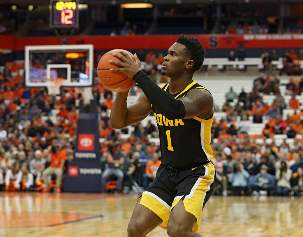 Iowa Hawkeyes guard Joe Toussaint (1) lines up a shot during the first half of their ACC/Big Ten Challenge game at the Carrier Dome in Syracuse, N.Y. on Tuesday, Dec 3, 2019. (Stephen Mally/hawkeyesports.com)