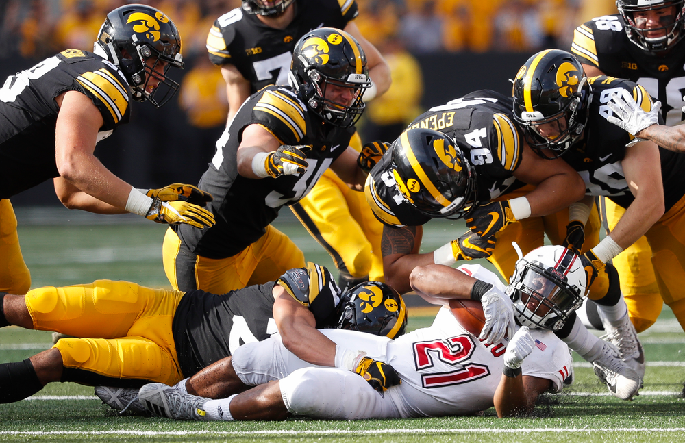 Iowa Hawkeyes defensive end Anthony Nelson (98), Iowa Hawkeyes linebacker Kristian Welch (34), Iowa Hawkeyes defensive back Amani Hooker (27), Iowa Hawkeyes defensive end A.J. Epenesa (94), Iowa Hawkeyes linebacker Nick Niemann (49)