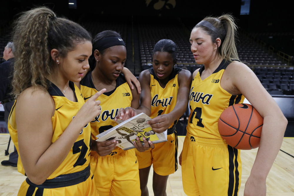 Iowa Hawkeyes guard Gabbie Marshall (24), guard Zion Sanders (21), guard Tomi Taiwo (1), and guard Megan Meyer (11) during the teamÕs annual media day Thursday, October 24, 2019 at Carver-Hawkeye Arena. (Brian Ray/hawkeyesports.com)