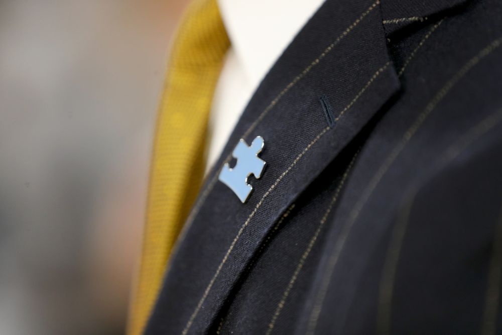 The Iowa Hawkeyes coaching staff wears Autism Awareness pins against Illinois Fighting Illini Sunday, February 2, 2020 at Carver-Hawkeye Arena. (Brian Ray/hawkeyesports.com)