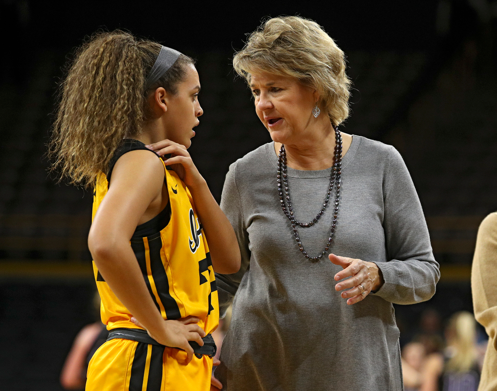 Iowa guard Gabbie Marshall (24) talks with head coach Lisa Bluder during the third quarter of their game against Winona State at Carver-Hawkeye Arena in Iowa City on Sunday, Nov 3, 2019. (Stephen Mally/hawkeyesports.com)