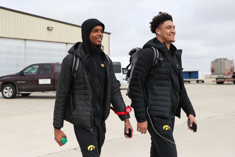 Iowa Hawkeyes guard Maishe Dailey (1) and forward Cordell Pemsl (35) board a flight to Columbus for the first and second rounds of the 2019 NCAA Men's Basketball Tournament Wednesday, March 20, 2019 at the Eastern Iowa Airport. (Brian Ray/hawkeyesports.com)