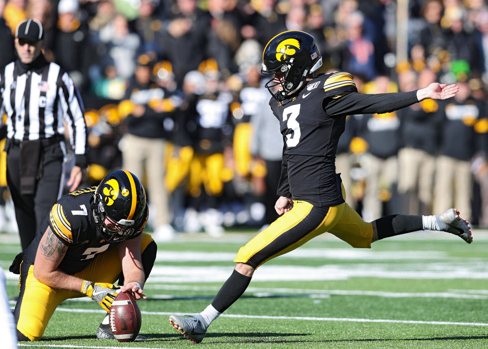 Iowa Hawkeyes place kicker Keith Duncan (3) kicks from the hold of punter Colten Rastetter (7) during the first quarter of their game at Kinnick Stadium in Iowa City on Saturday, Nov 23, 2019. (Stephen Mally/hawkeyesports.com)