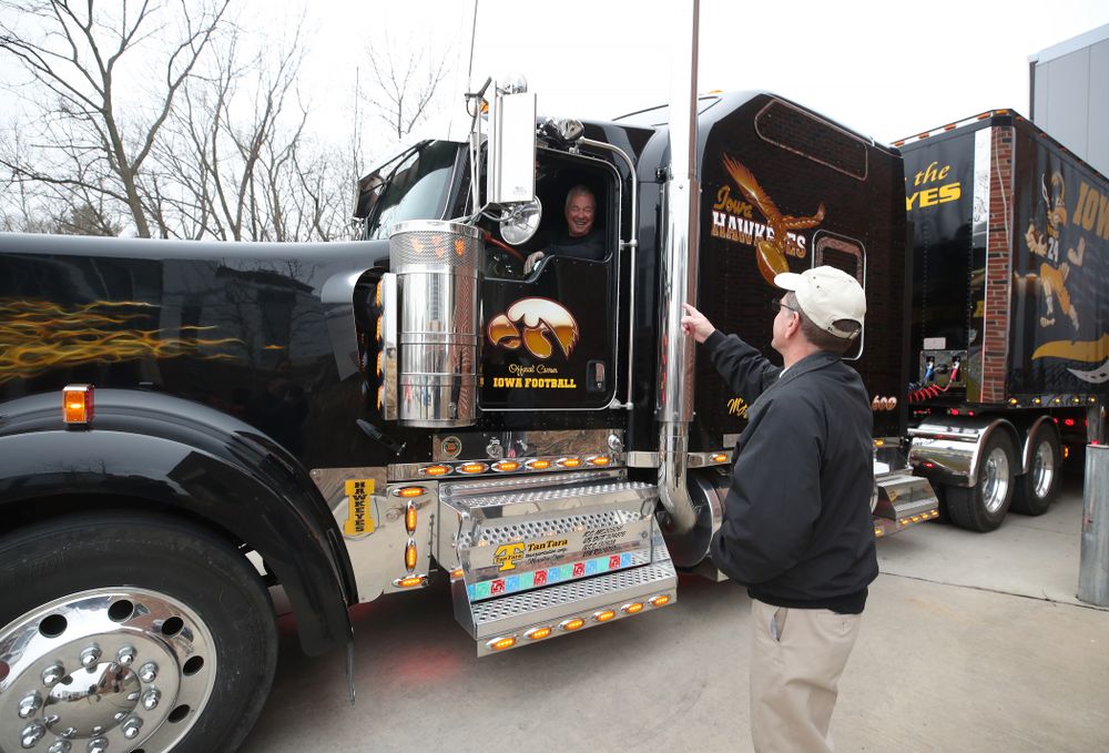 TanTara Transportation Corporation President Mike Riggan talks with head football equipment manager Greg Morris before departing for Tampa Florida Friday, December 21, 2018 at the Hansen Football Performance Center. (Brian Ray/hawkeyesports.com)
