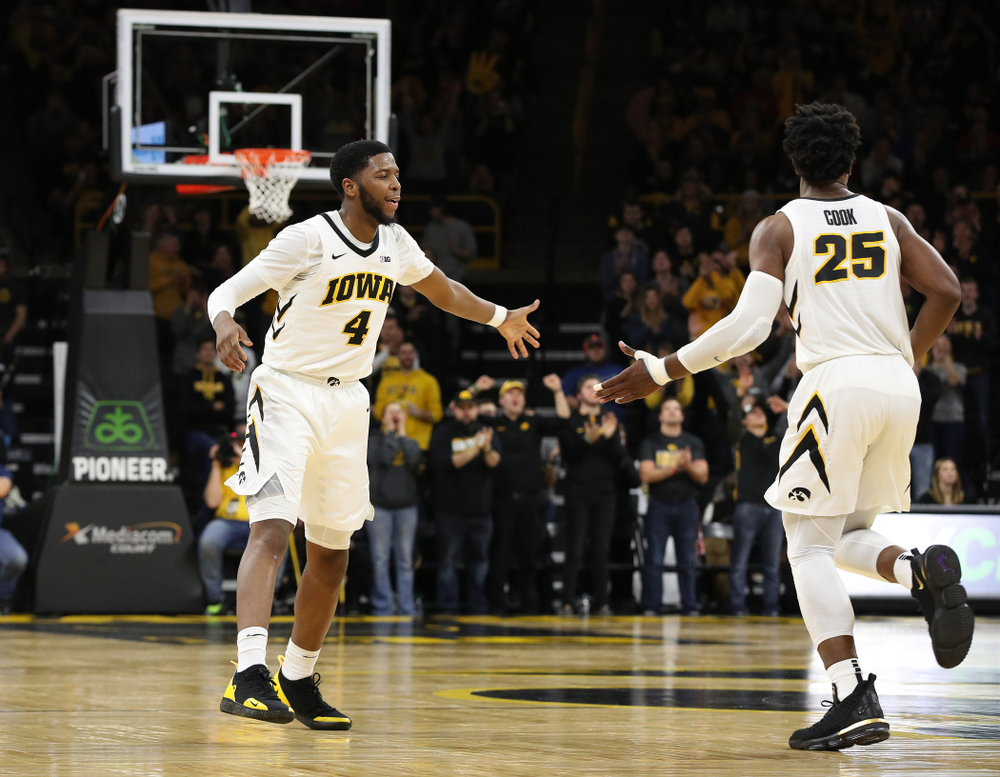 Iowa Hawkeyes guard Isaiah Moss (4) and forward Tyler Cook (25) against the Ohio State Buckeyes Saturday, January 12, 2019 at Carver-Hawkeye Arena. (Brian Ray/hawkeyesports.com)