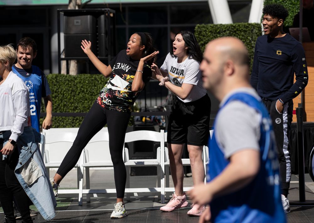 Iowa Hawkeyes forward Megan Gustafson (10) and UCONNÕs Napheesa Collier cheer on the athletes during a Special Olympics Event Friday, April 12, 2019 in the XBOX Plaza at LA Live. (Brian Ray/hawkeyesports.com)