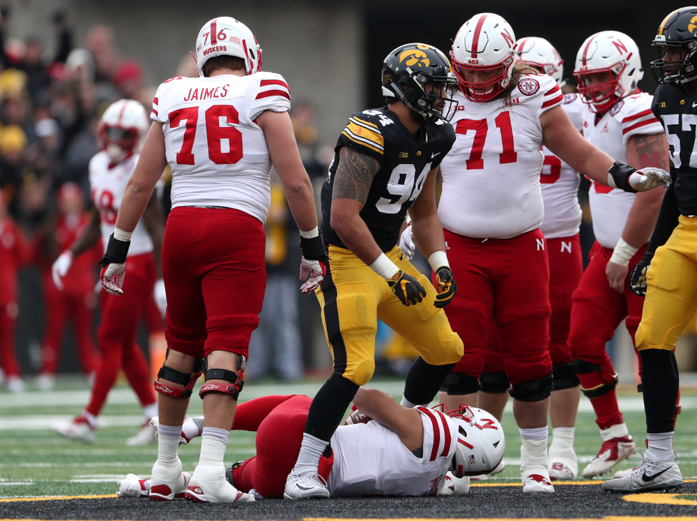 Iowa Hawkeyes defensive end A.J. Epenesa (94) sacks Nebraska Cornhuskers quarterback Adrian Martinez (2) Friday, November 23, 2018 at Kinnick Stadium. (Brian Ray/hawkeyesports.com)