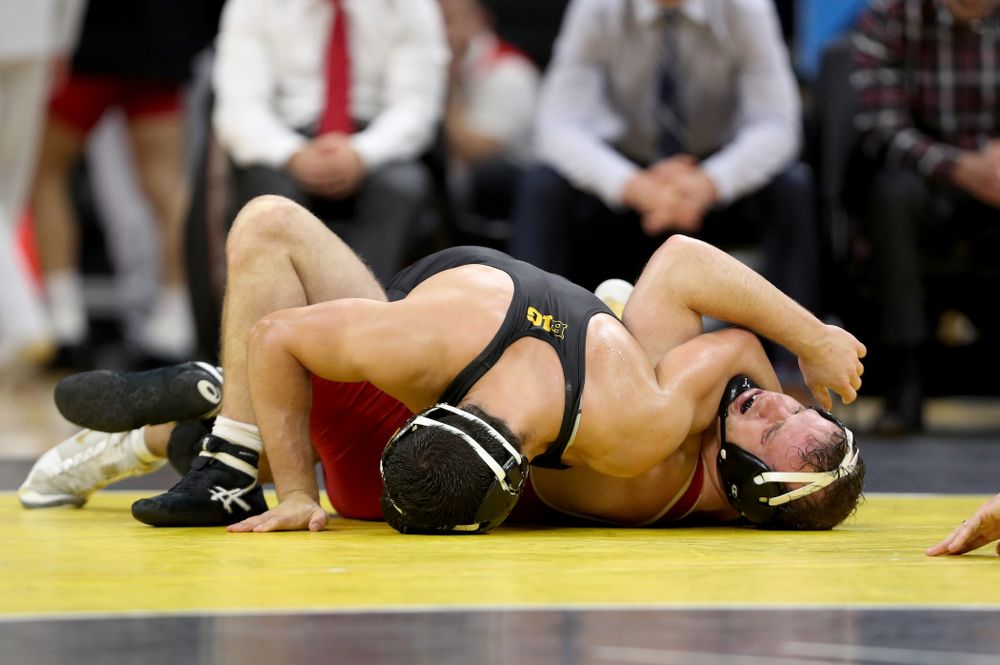IowaÕs Michael Kemerer wrestles WisconsinÕs Jared Krattinger at 174 pounds Sunday, December 1, 2019 at Carver-Hawkeye Arena. Kemerer won the match with a fall. (Brian Ray/hawkeyesports.com)