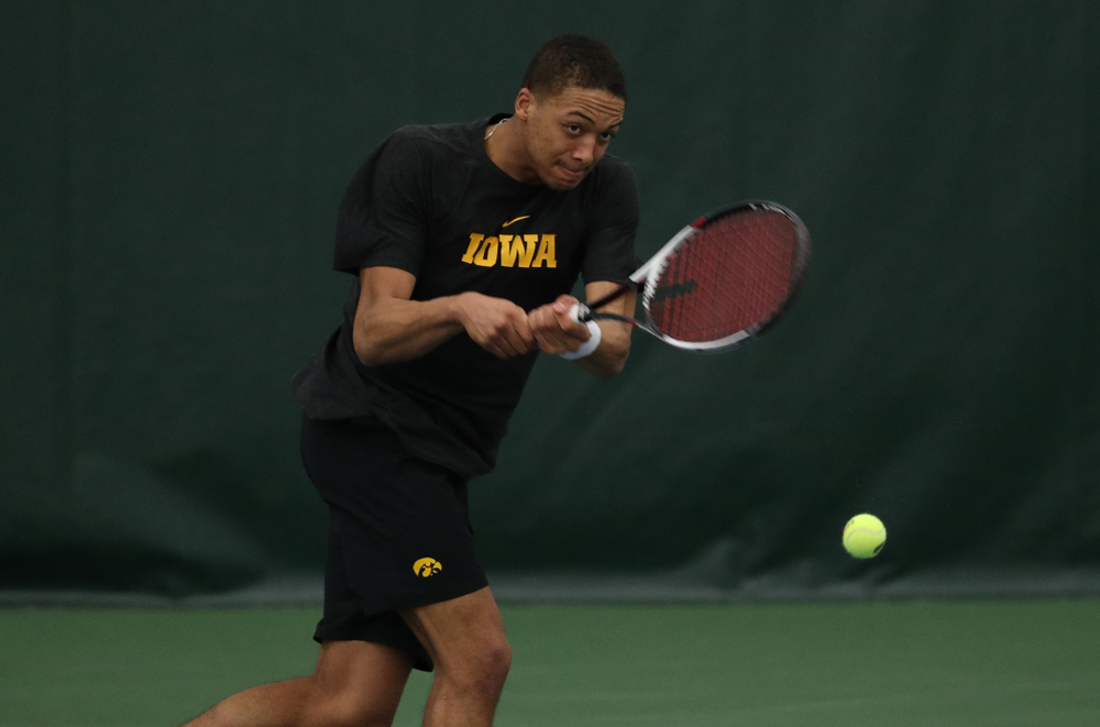 Iowa's Oliver Okonkwo against UMKC Friday, February 15, 2019 at the Hawkeye Tennis and Recreation Complex. (Brian Ray/hawkeyesports.com)