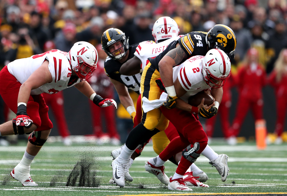 Iowa Hawkeyes defensive end A.J. Epenesa (94) sacks Nebraska Cornhuskers quarterback Adrian Martinez (2) Friday, November 23, 2018 at Kinnick Stadium. (Brian Ray/hawkeyesports.com)