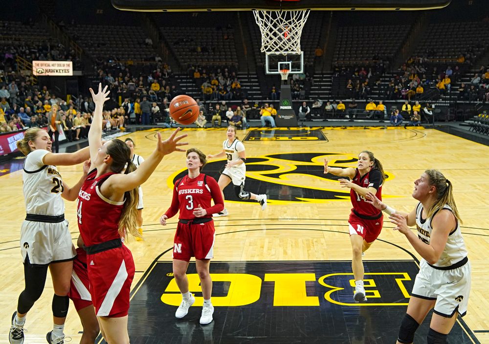 Iowa Hawkeyes guard Kathleen Doyle (22) passes the ball to forward Monika Czinano (25) for an assist as Czinano scores during the second quarter of the game at Carver-Hawkeye Arena in Iowa City on Thursday, February 6, 2020. (Stephen Mally/hawkeyesports.com)
