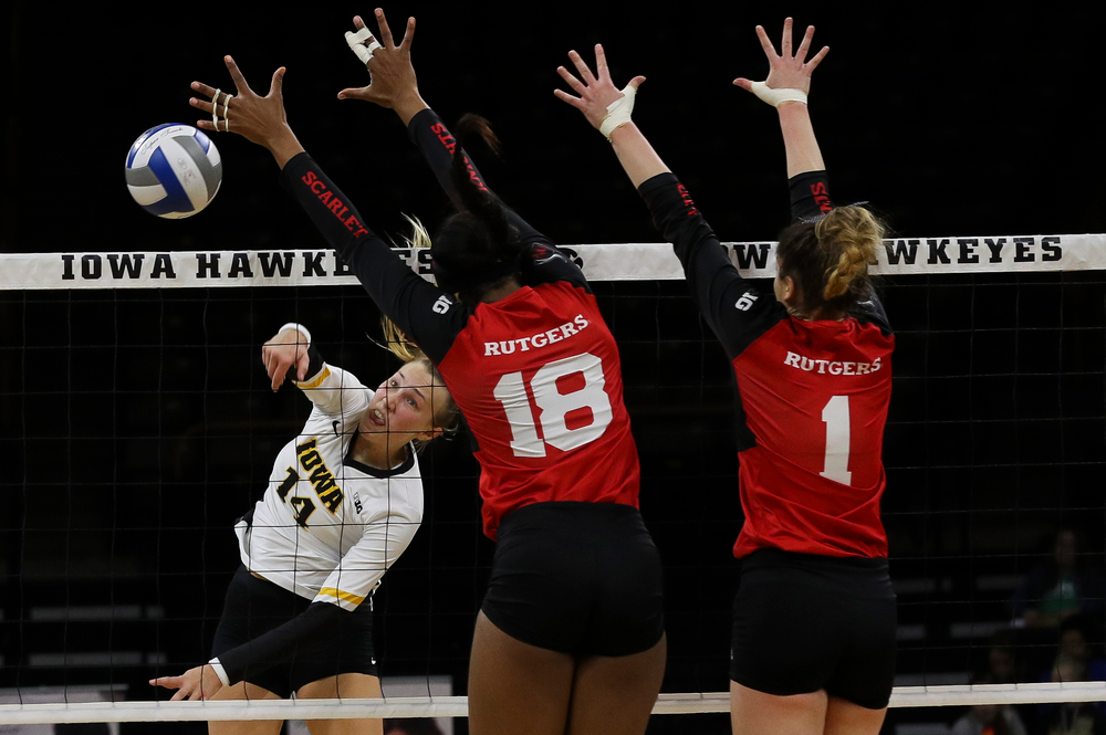 Iowa Hawkeyes outside hitter Cali Hoye (14) spikes the ball during a match against Rutgers at Carver-Hawkeye Arena on November 2, 2018. (Tork Mason/hawkeyesports.com)